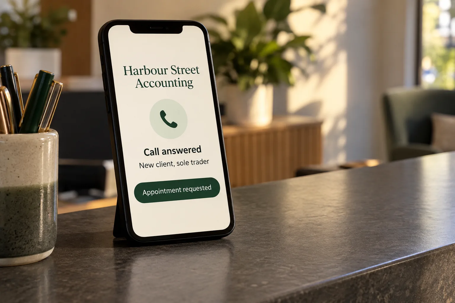 A phone on an accounting office counter showing a Harbour Street Accounting call answered concept
