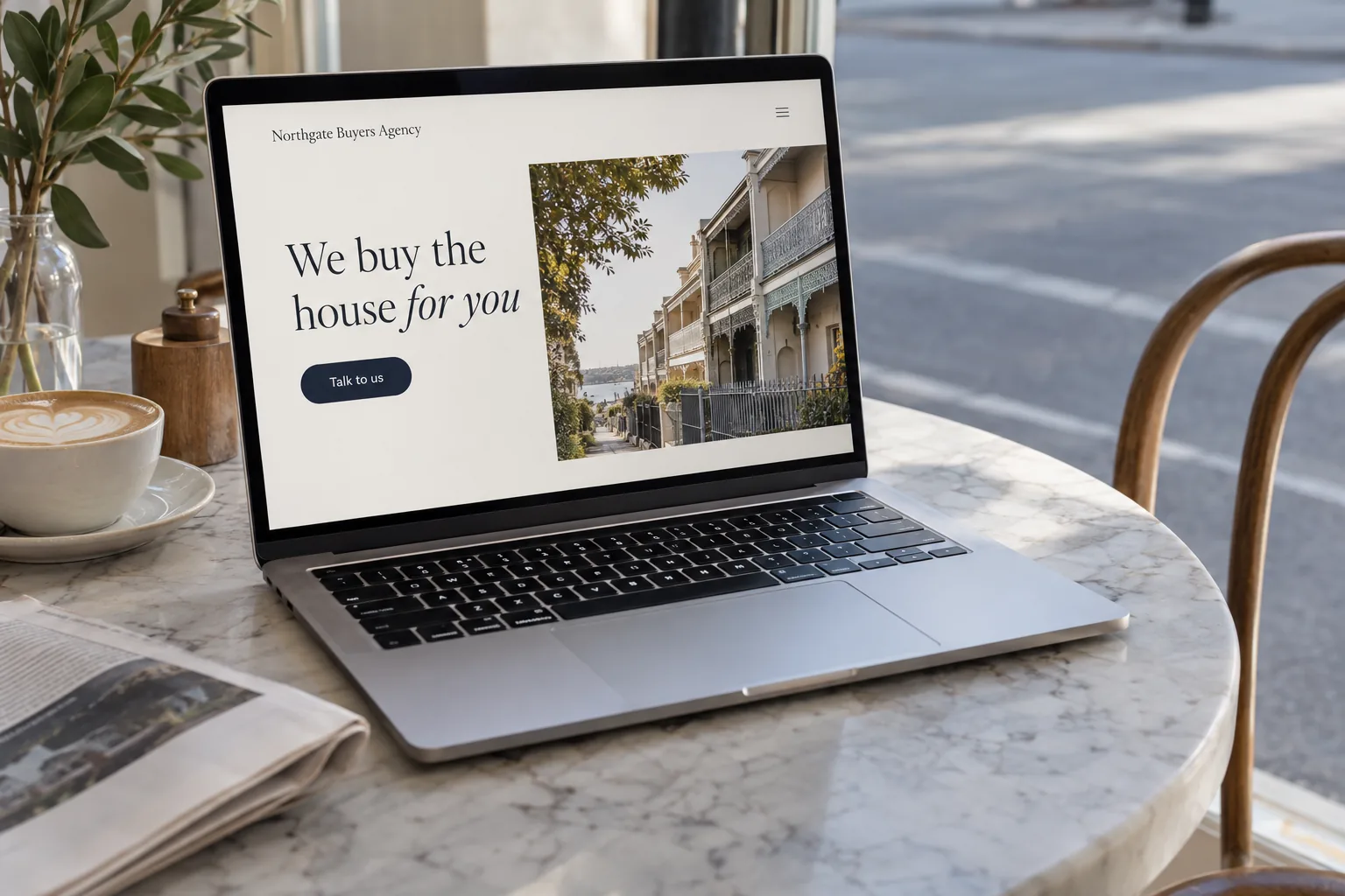 A laptop showing a buyers agency website concept