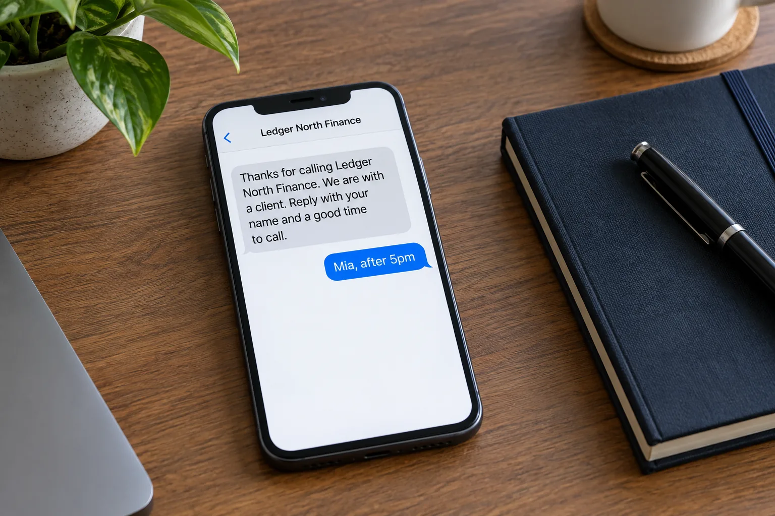 A phone on a desk showing a Ledger North Finance missed-call callback text concept