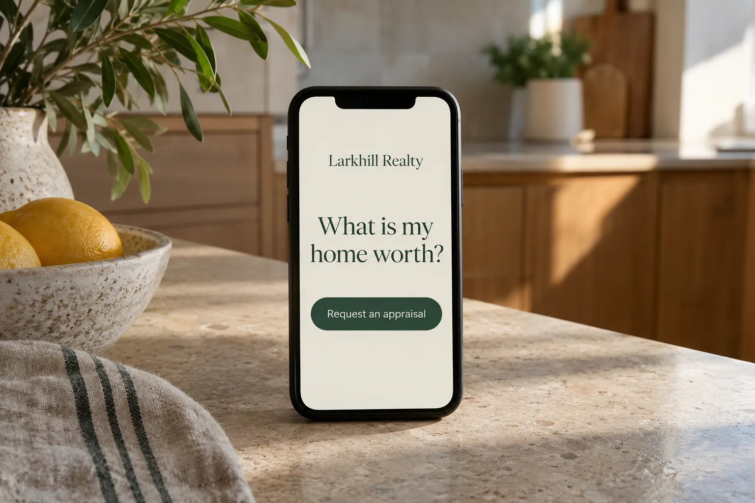 A phone on a kitchen bench showing a Larkhill Realty request an appraisal screen concept