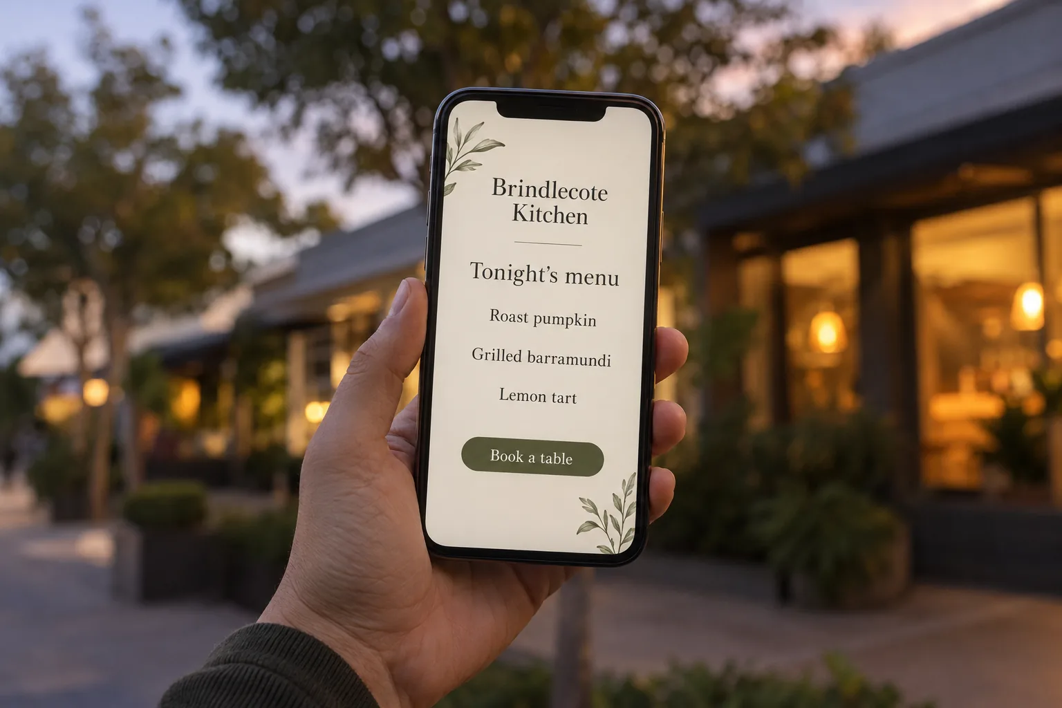 A phone showing a Brindlecote Kitchen menu page concept